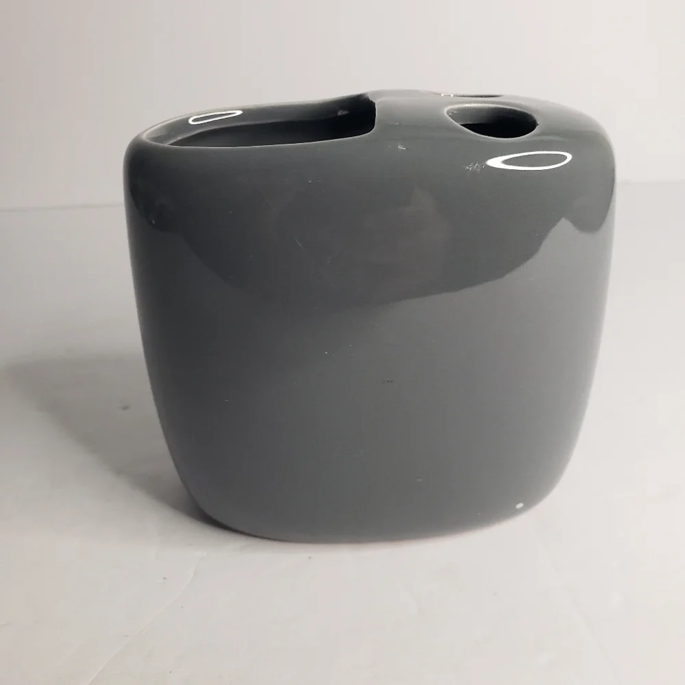 Ceramic toothbrush and toothpaste holder. 171